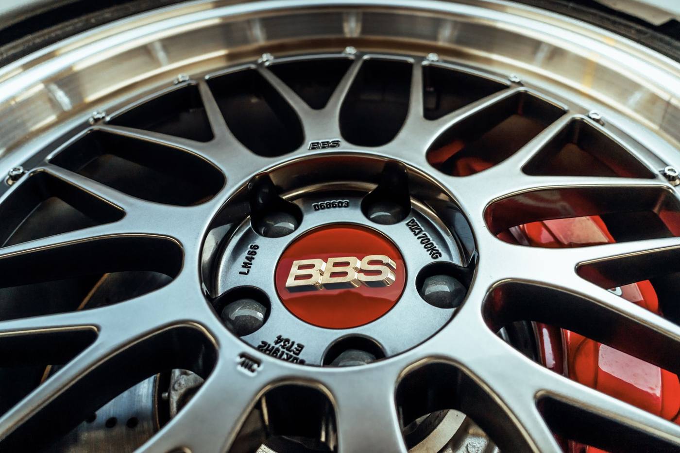 Close-up of a machined silver alloy face on a different wheel, in good condition